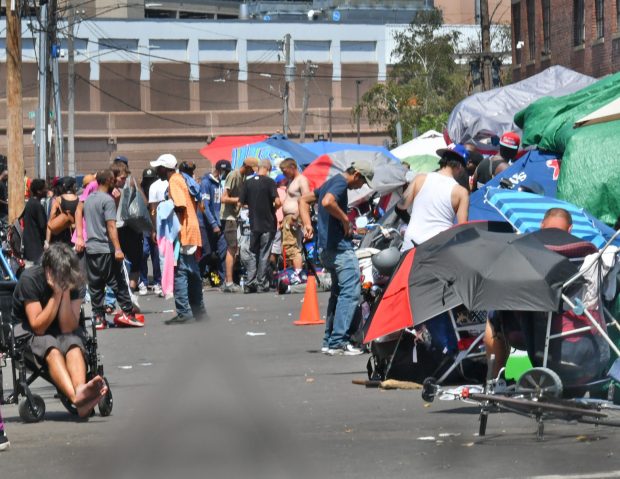 The scene along Atkinson Street Sunday in the area and Mass and Cass. Staff Photo Chris Christo/Boston Herald