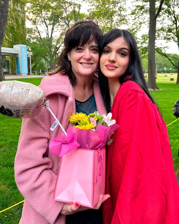 In this undated photo provided by Rabbi Meir Hecht on behalf of the Raanan family is Judith Raanan, left, and her daughter Natalie, 18, after Natalie's recent high school graduation. On Friday, Oct. 20, 2023, Israel announced the two American women held by Hamas were released. Judith and Natalie went missing while visiting relatives in Nahal Oz for Simchat Torah, a festive Jewish holiday that marks the conclusion of the annual reading of the Torah. (Raanan Family via AP)