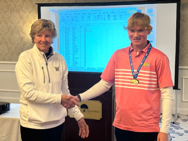 Jack Carstensen St. John Paul II, right, shot a 74 to capture the Div. 3 state golf individual title. (Tom Mulherin photo)