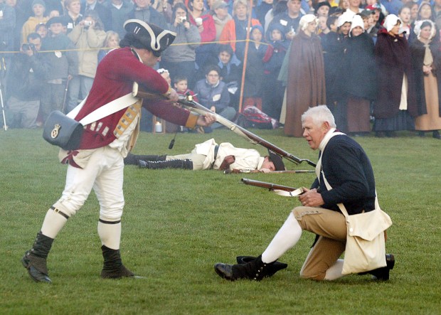 (4/18/05 Lexington, MA) A redcoat bayonettes a minuteman during the re-enactment of the battle of Lexington. (A09G0047.JPG - Staff Photo by Jon Hill. Saved in Tuesday )