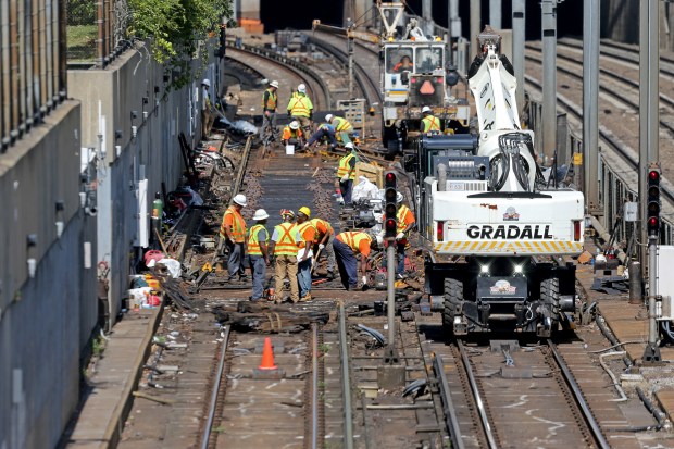 BOSTON, MA - August 30:      Construction workers replace the tracks along the Jackson Station area during the one month shut down of the MBTA Orange Line on  August 30, 2022 in , BOSTON, MA. (Staff Photo By Stuart Cahill/MediaNews Group/Boston Herald)